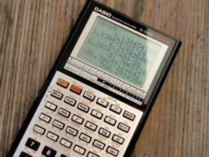 Graphing calculator lying on wood