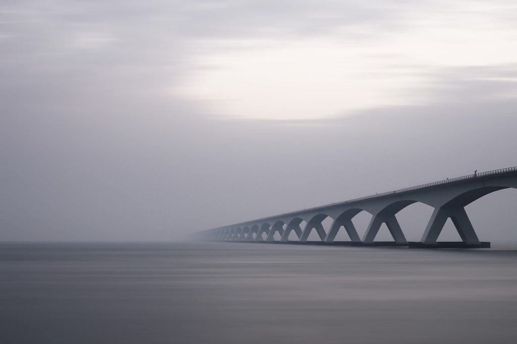 Grey modern bridge on a cloudy day