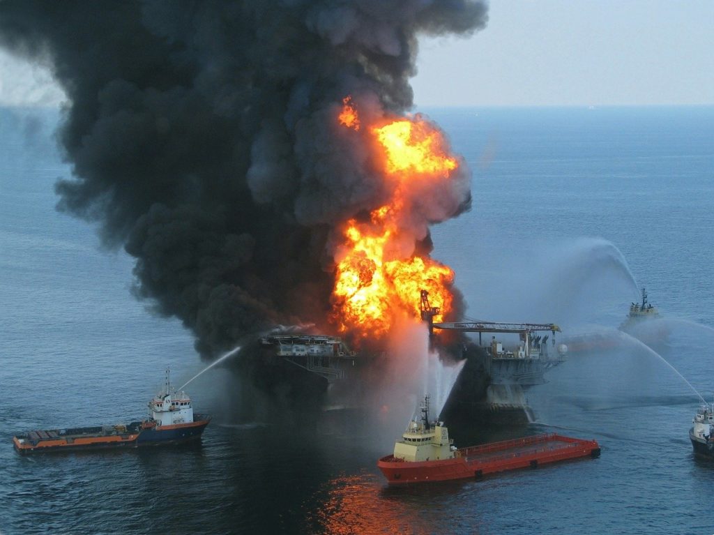 Oil rig on fire in the ocean