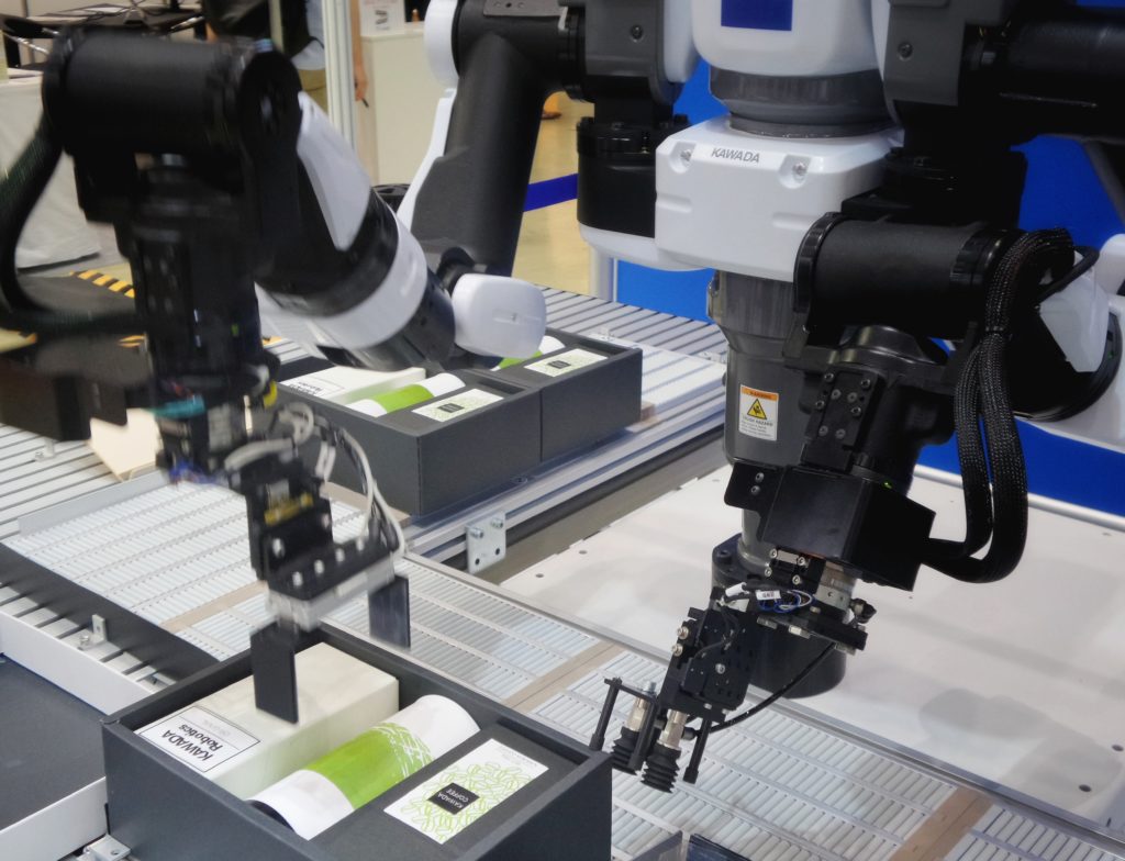 Robotic arms in an assembly line