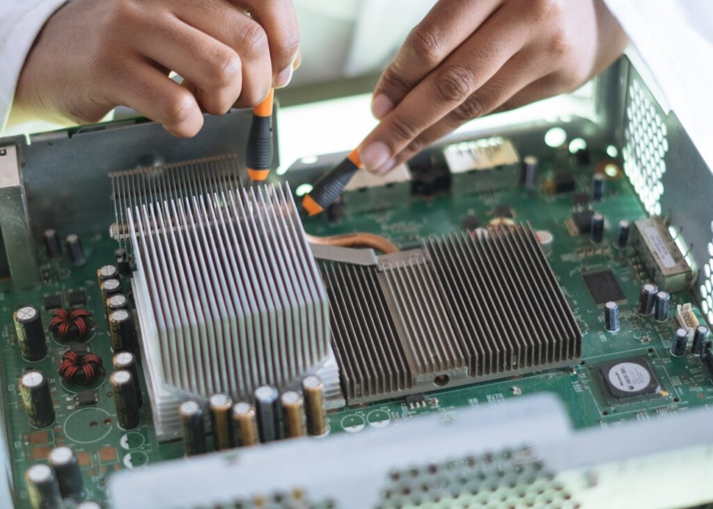 Electrical engineer checking motherboard