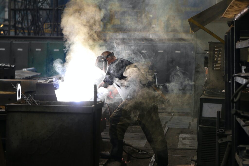 Machine worker manufacturing a steel product