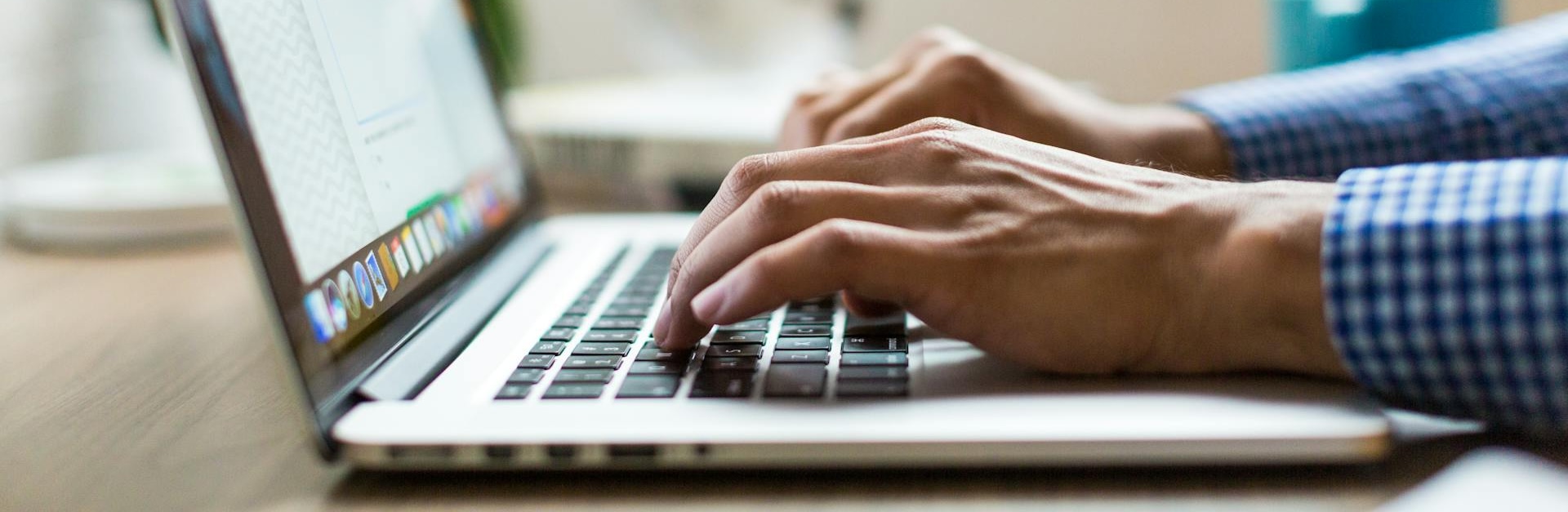 Professional typing on laptop